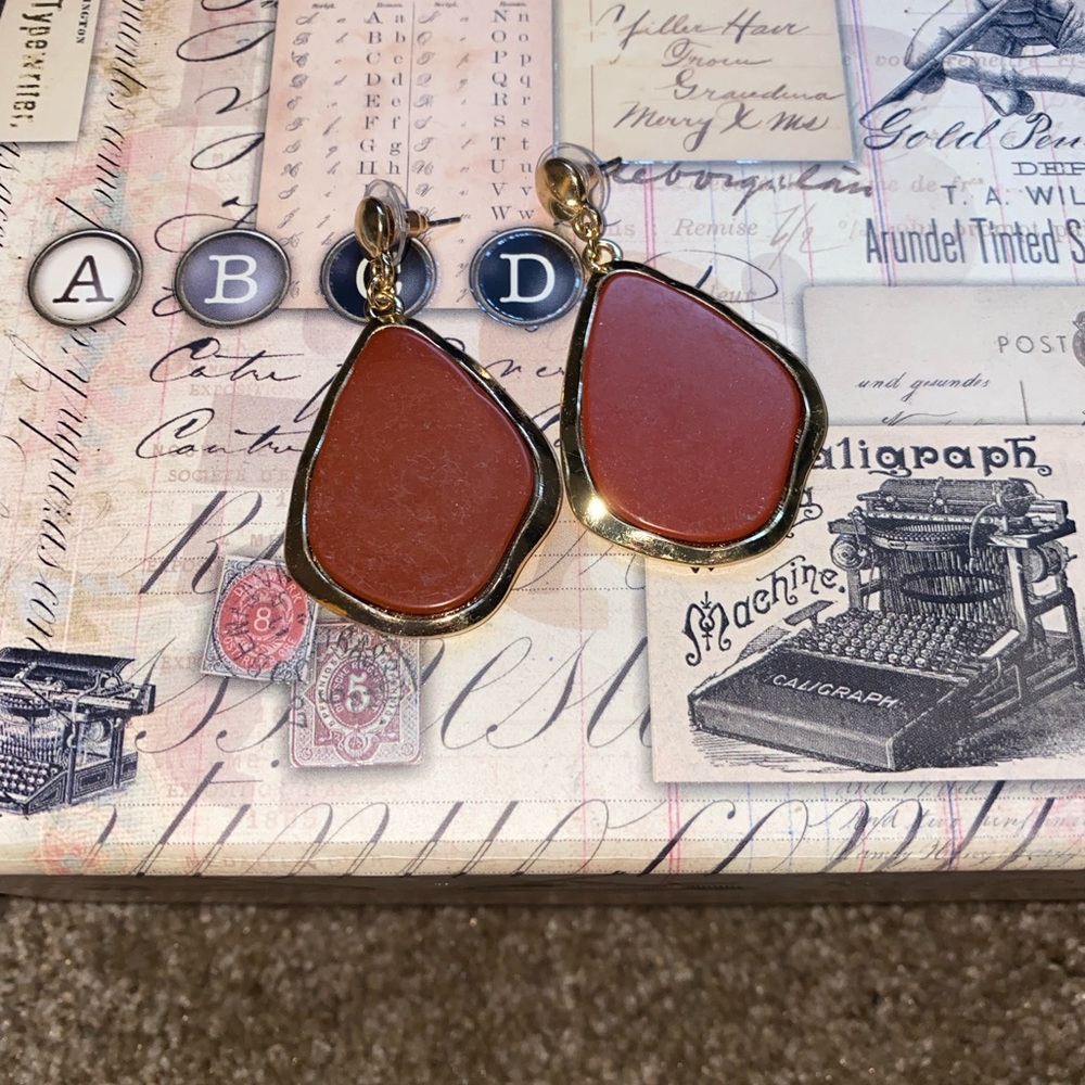 Women’s red and gold earrings